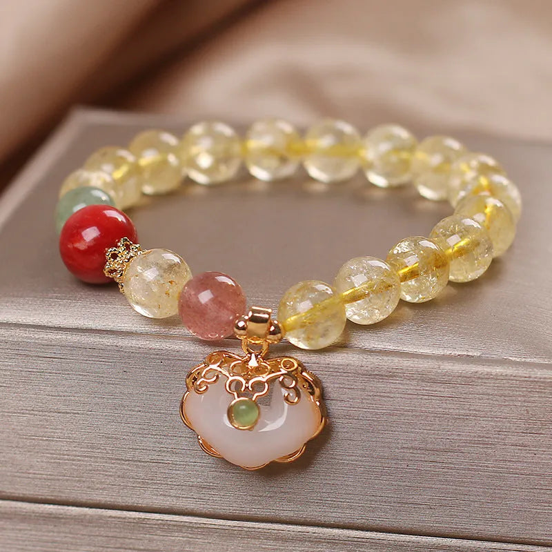Women's alloy bracelet with a yellow natural citrine jade ruyi pendant.