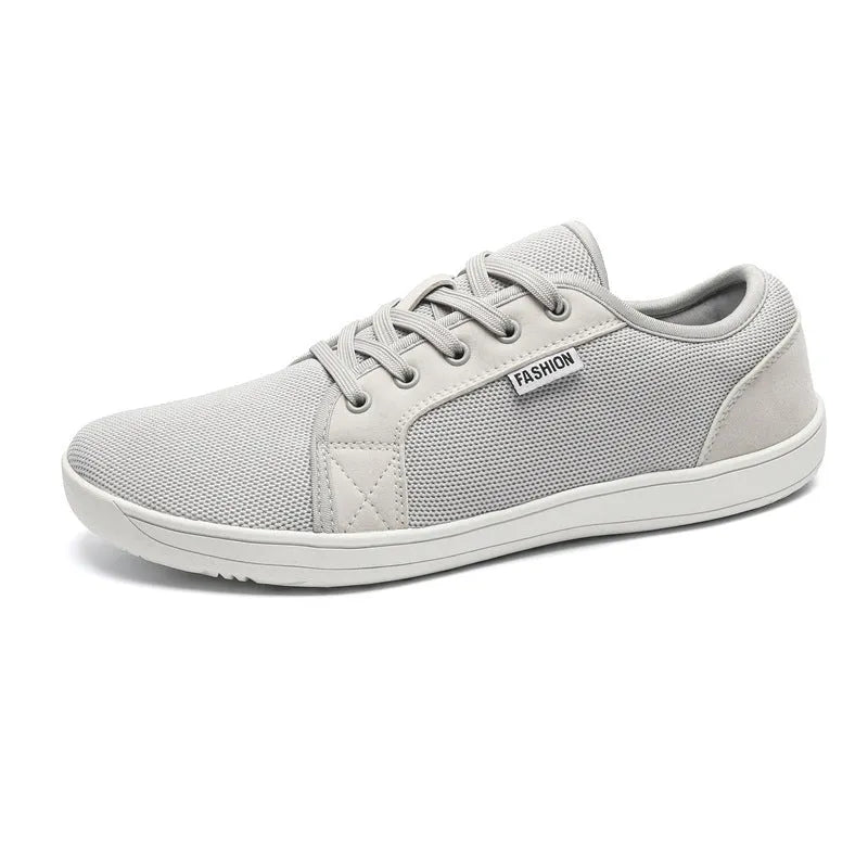 Men's low-top lace-up leisure sneaker with mesh upper, rubber sole, wide toe, flat heel, in black colour