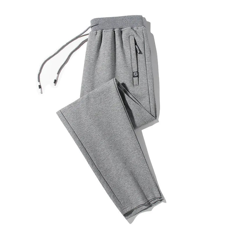 Plum Label men's large size casual sweatpants in flat black cotton knit with drawstring waist and skinny leg