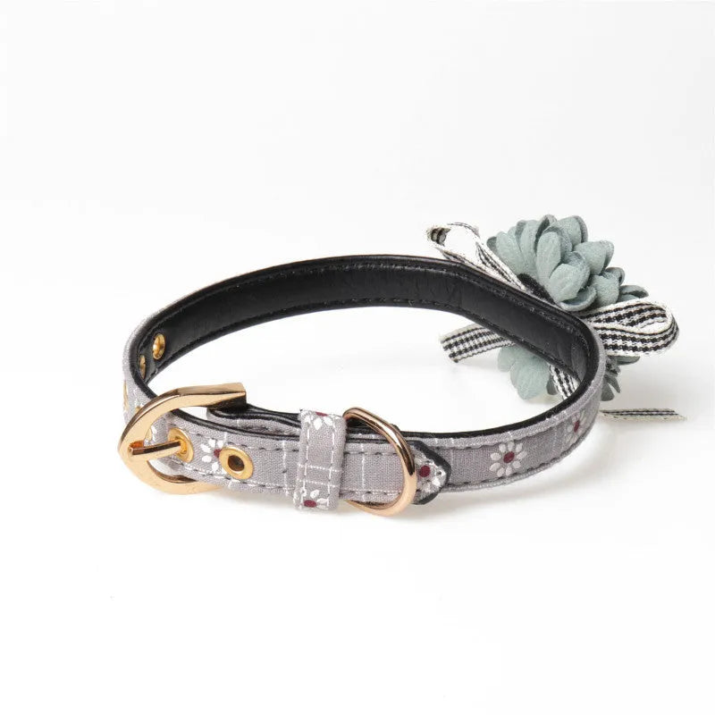 PU flower pet collar in dark pink with adjustable buckle, shown on a small dog