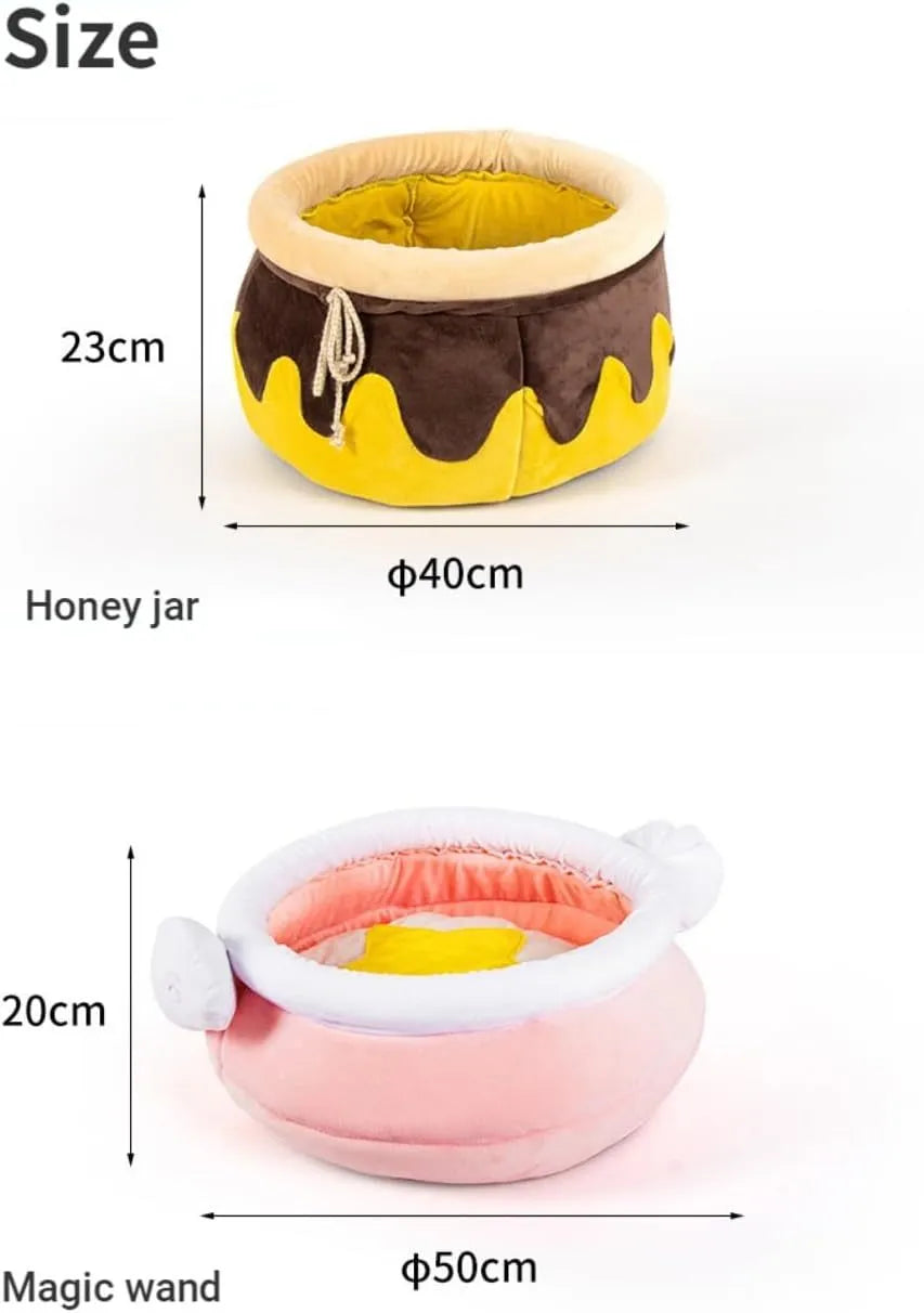 Pink honey pot-shaped cat sofa bed with a magic wand, showing a removable cushion inside.