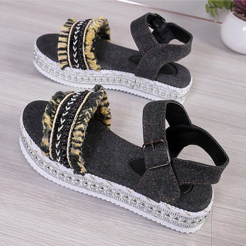 Women's tassel denim sandals with thick flat sole and buckle closure in blue