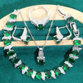 Bridal zircon four-piece jewellery set showing necklace, bracelet, earrings and ring with water wave chain design