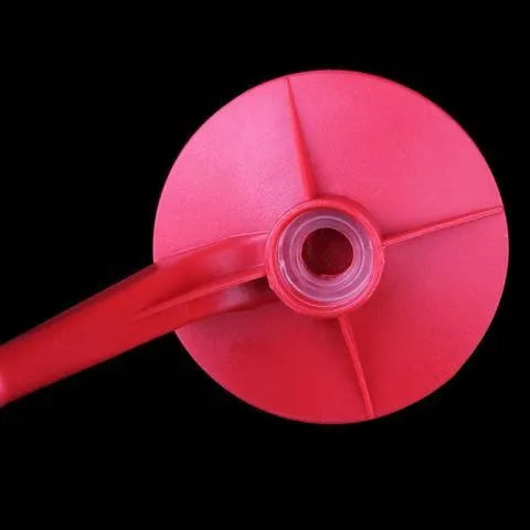Red plastic Magic Tap soda dispenser for 2-liter bottles with push-button mechanism