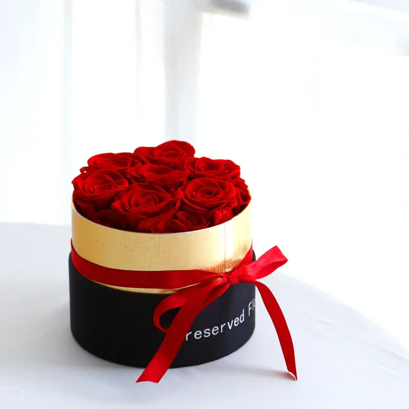 Eternal preserved real roses arranged in a decorative presentation gift box.