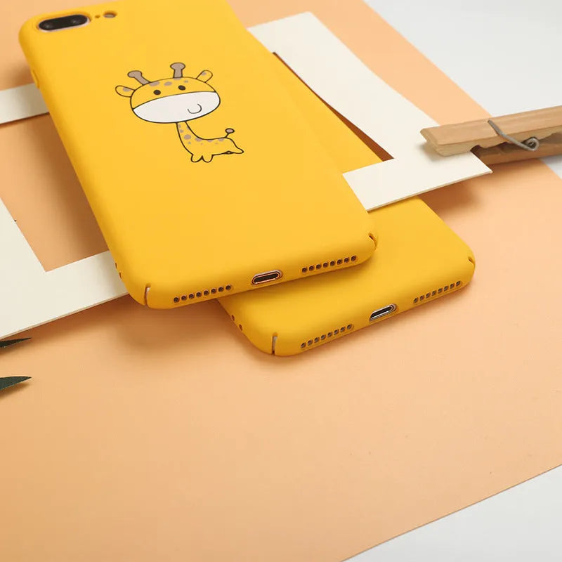 Yellow patterned hard plastic phone case for Apple iPhone models on a flat surface.