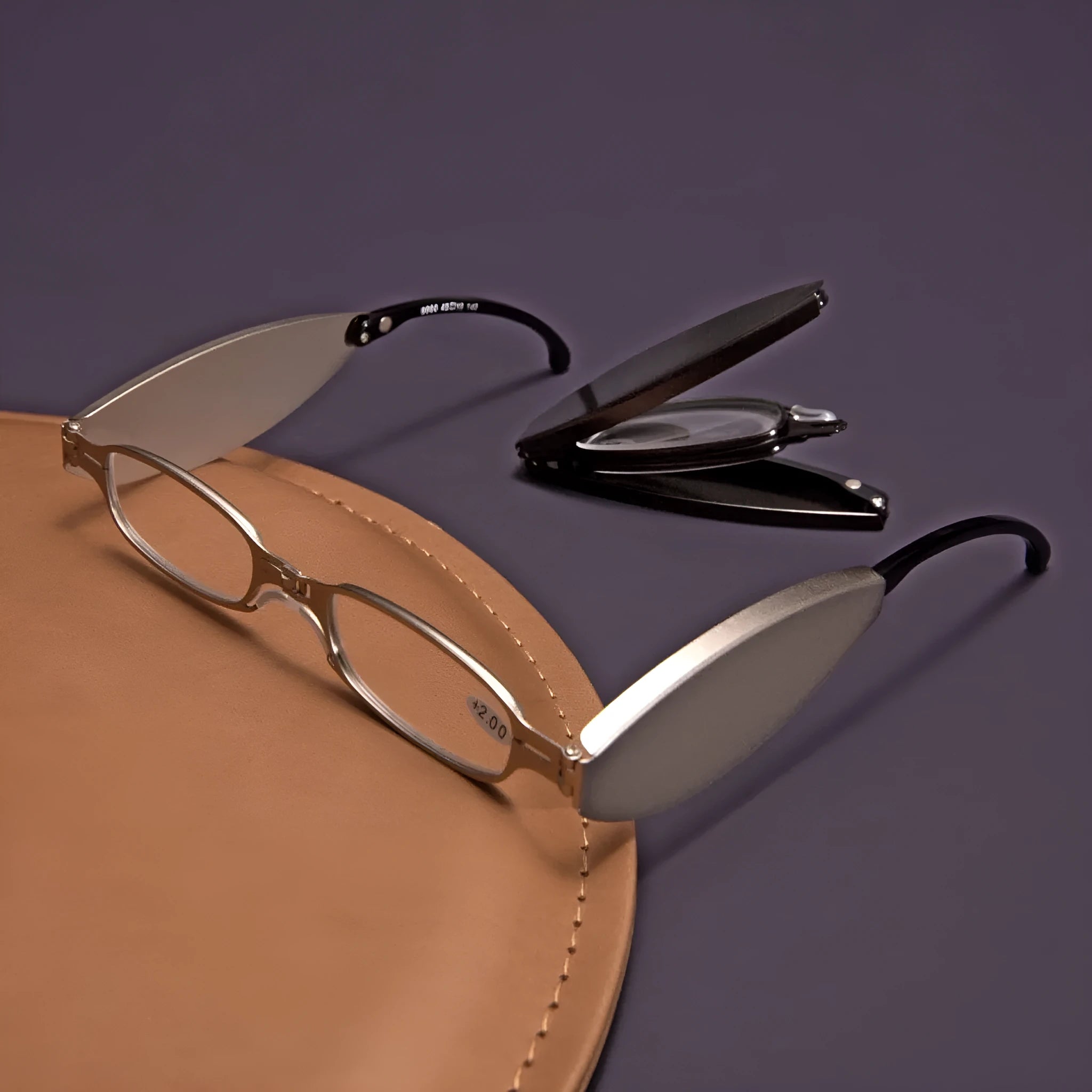 Black folding presbyopic glasses with retro frame and ring detailing, shown in open and closed positions