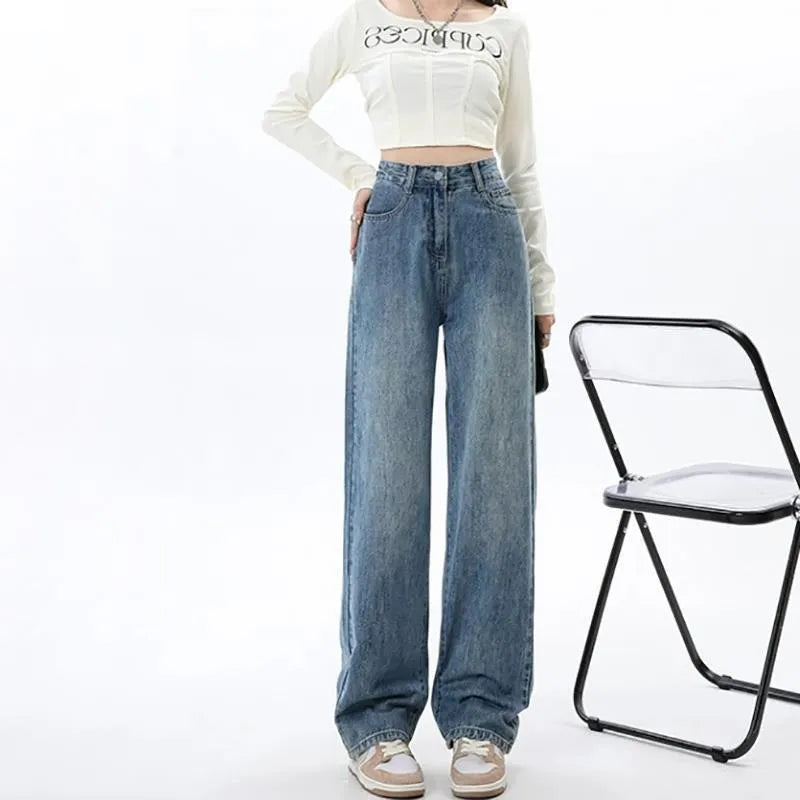 Woman wearing retro blue high waist wide leg jeans with a straight cut