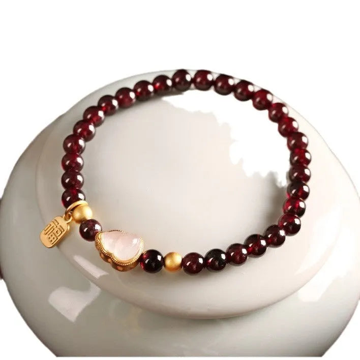 Chinese style gourd bracelet with imitation garnet beads and traditional Fu character charm on adjustable U-shaped design