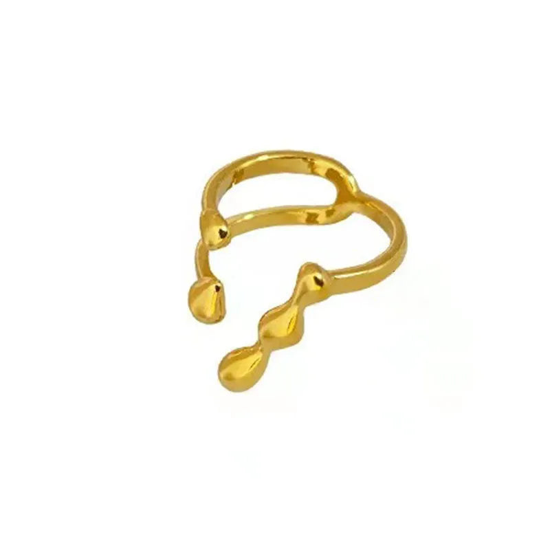 Gold and silver brass women's fashion ring with spherical design detail.