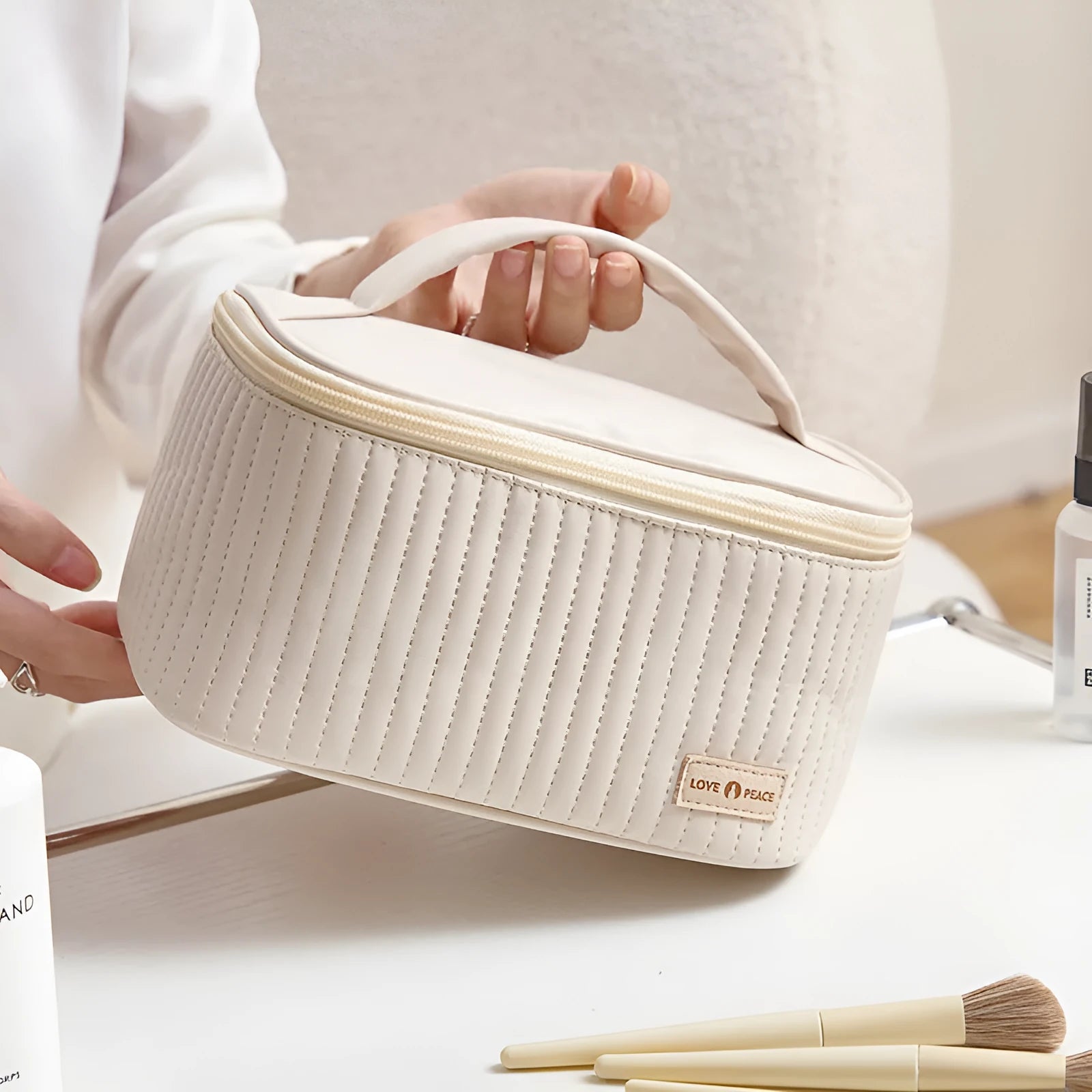 Open-top cake-shaped women's makeup bag in PU leather, shown in a choice of solid colours.