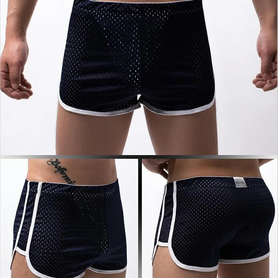 Men's cotton blend boxer shorts in black, showing mid waist and breathable knit fabric.