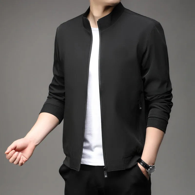Man wearing a loose-fit black lapel collar casual jacket, Korean style, with zippered pockets.