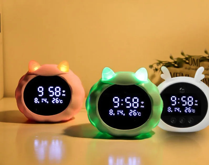 Smart alarm clock with voice control and human body sensor in silicone construction with luminous display