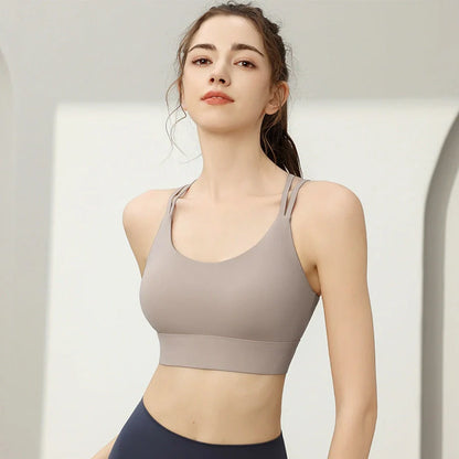 Women's anti-shock sports bra with integrated back design in multiple colours including milk coffee and coral pink options