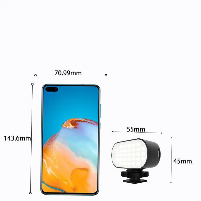 Black aluminium alloy mobile phone fill light with digital display, shown with six colour filters and a silicone diffuser.