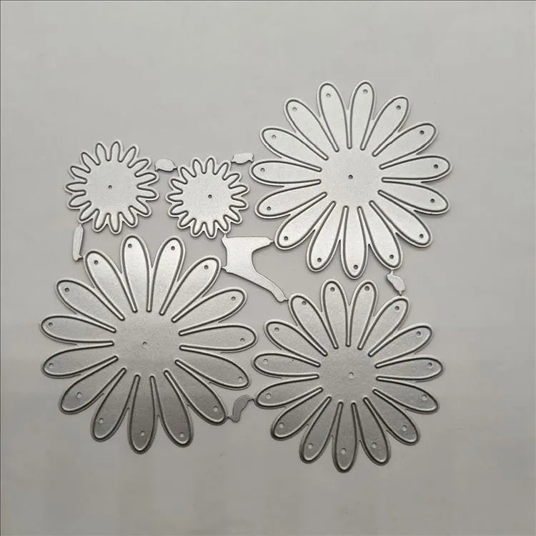 Silver high carbon steel cutting mold with etched flower decoration measuring 12.5x13 cm