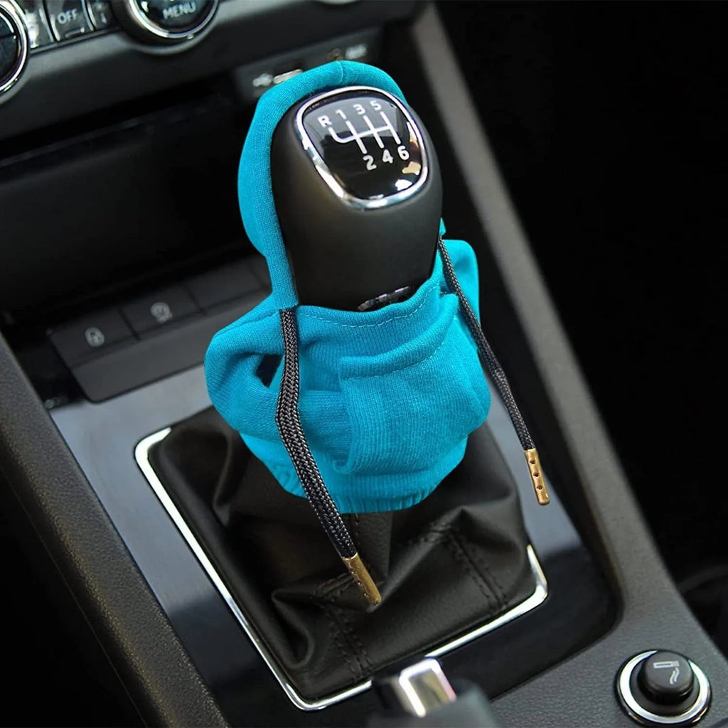 Blue cloth gear shift knob hoodie cover shown on a car gear lever.