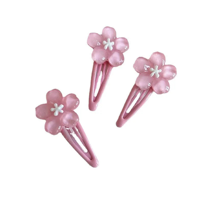 Handmade acrylic cherry blossom hair clip in pink floral design for women