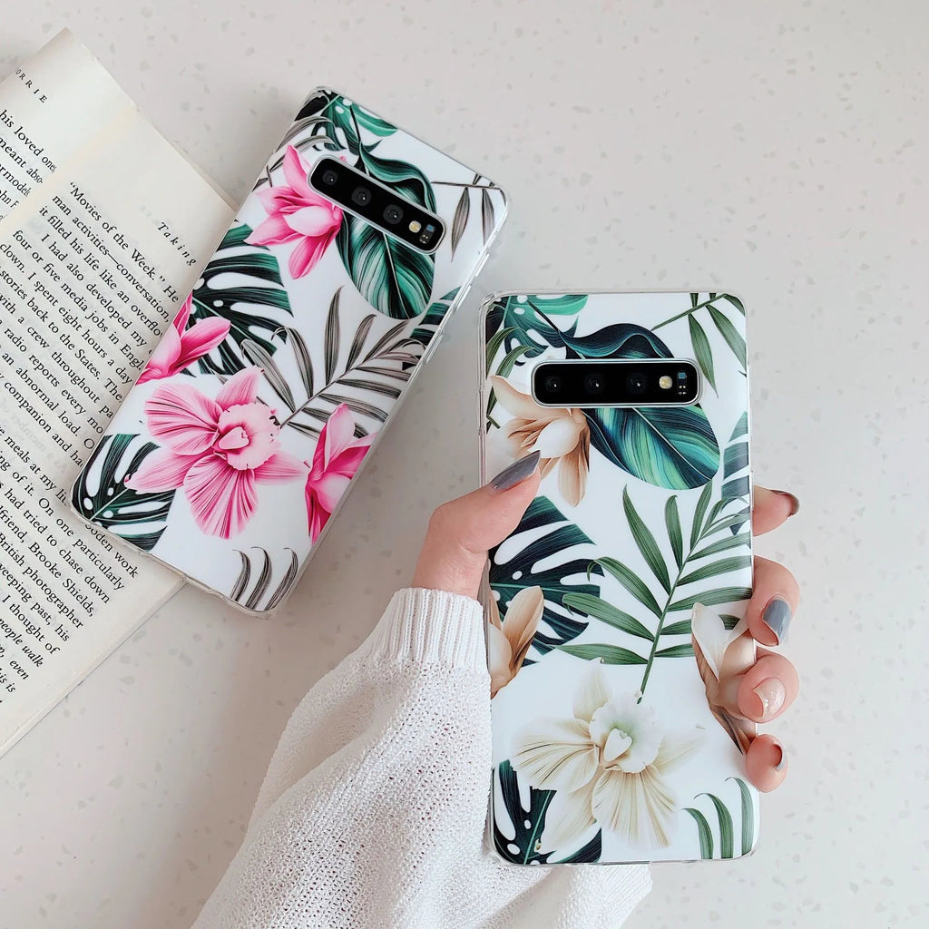 Green leaf flower patterned TPU phone case for Samsung Galaxy phones on a table.