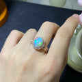 Handmade adjustable opal ring on a sterling silver open band with gold tone plating.
