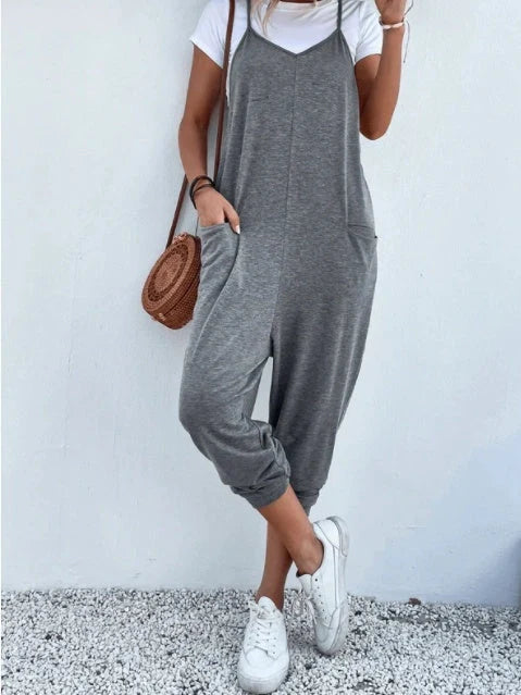 Women's sleeveless polyester jumpsuit with zipper and patch pockets in various colours