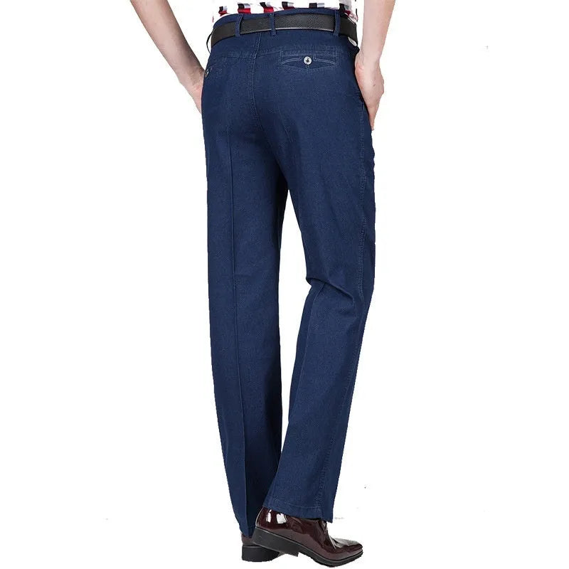 Men's high-waist loose-fit blue denim jeans on a hanger, showing the zip fly and relaxed leg cut.