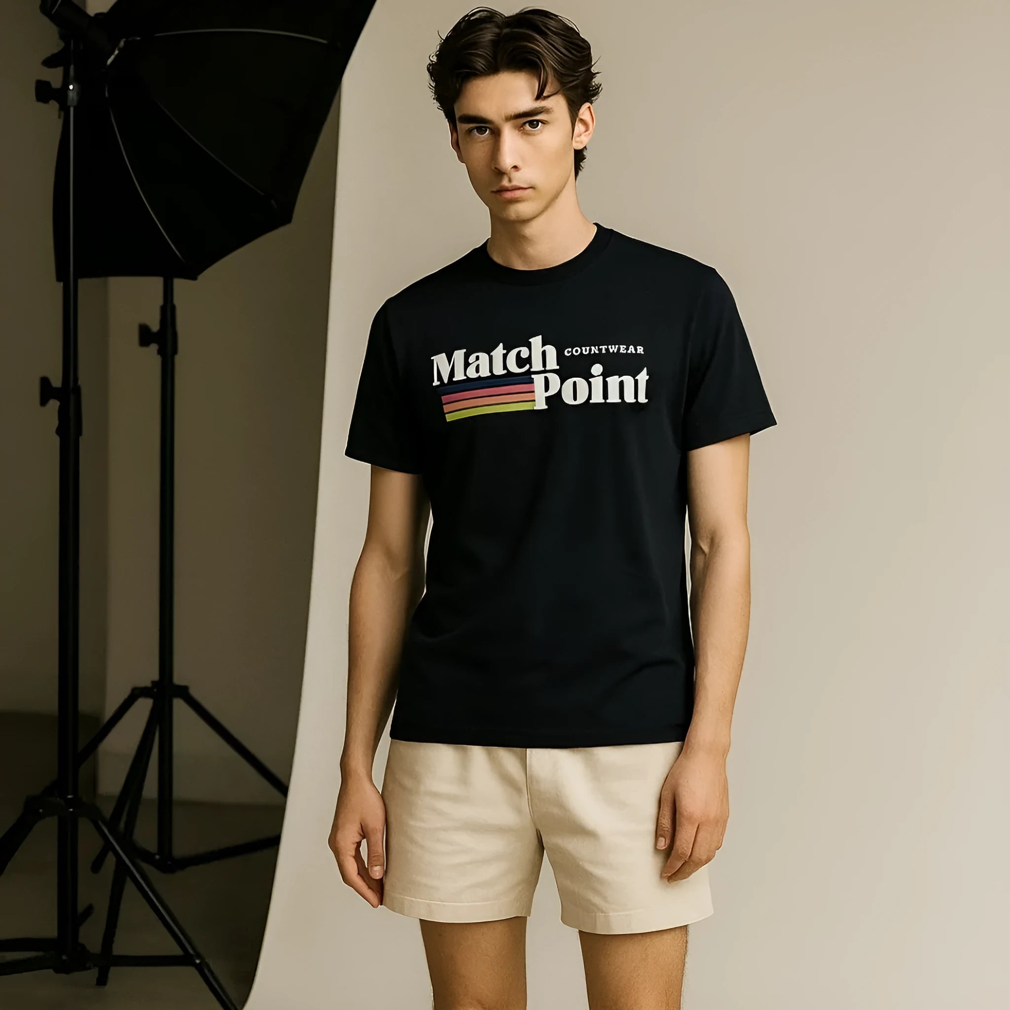 Black men's short sleeve tee shirt with a printed text pattern on the front.