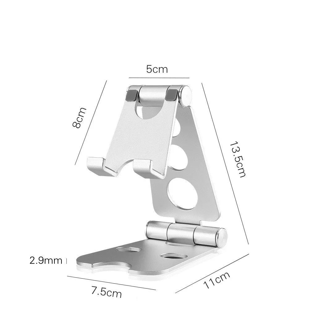 Folding mini mobile phone bracket in black on a wooden desk holding a smartphone