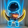 Wall mounted astronaut LED neon light with moon design and lemon yellow accents measuring 30x35cm
