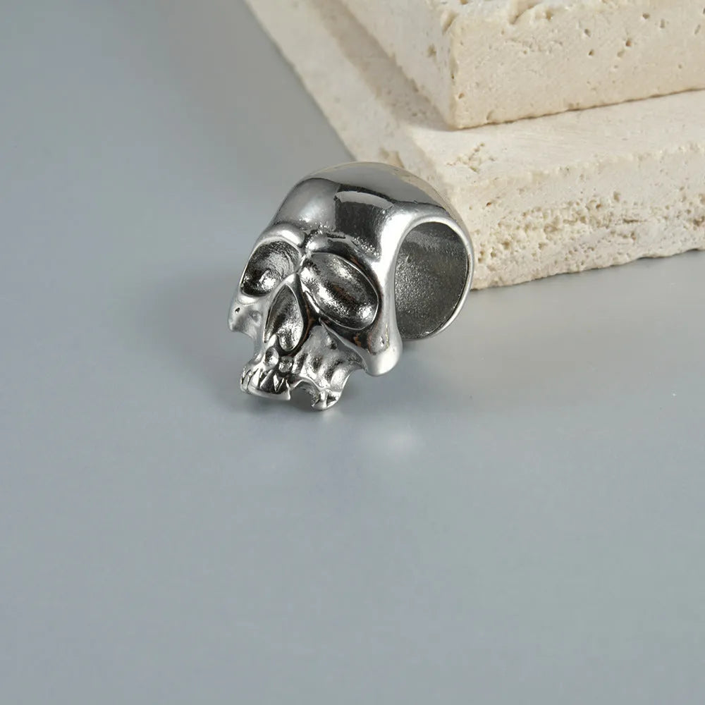 Stainless steel hollow skull and Buddha head geometric ear cuff for hip hop style.