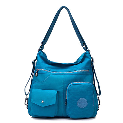 Women's waterproof nylon crossbody bag with organizational pockets and 34cm laptop capacity