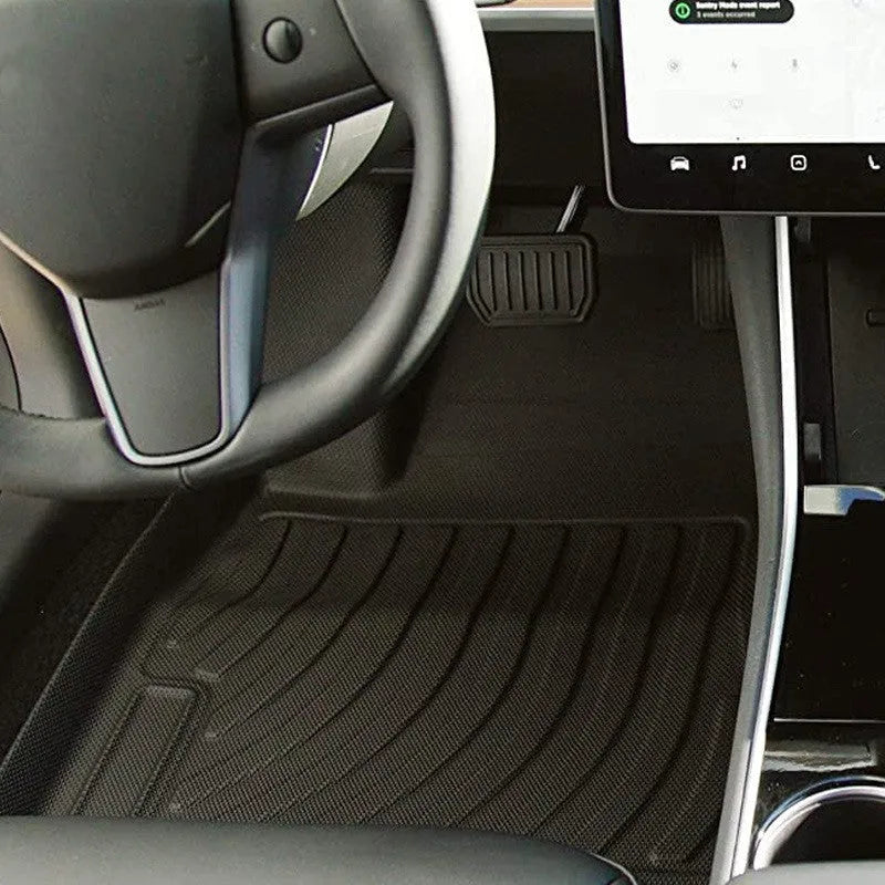 Rubber floor mat for Tesla car with TPE footrest section.
