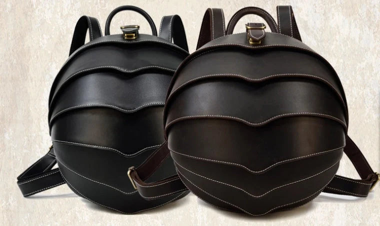 Vintage leather backpack in dark brown and black with multiple pockets