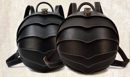 Vintage leather backpack in dark brown and black with multiple pockets