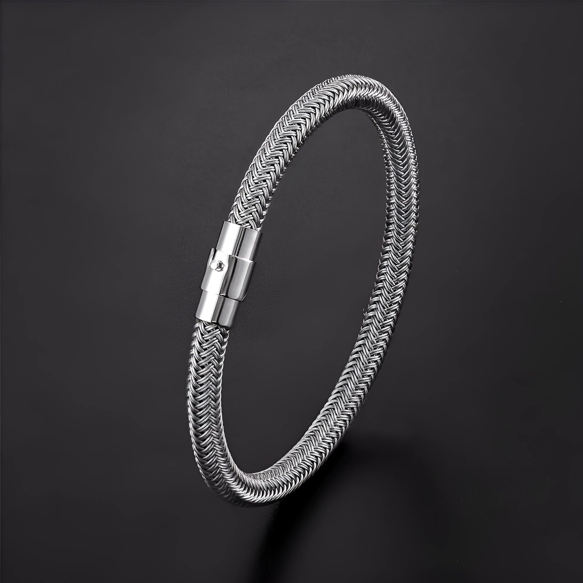 Titanium steel geometric wire bracelet with a magnetic clasp shown in one of four colour options.