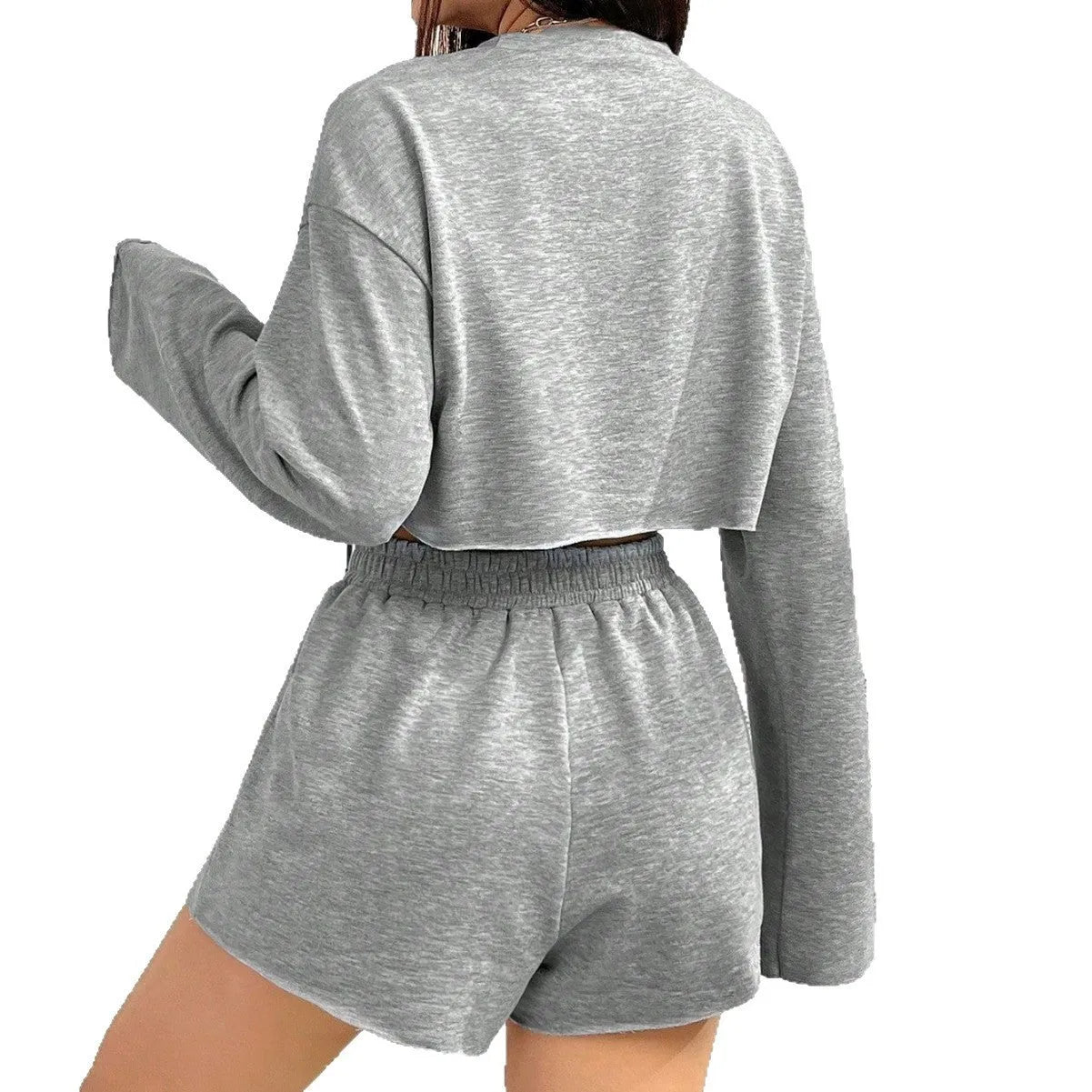 Women's grey long-sleeved t-shirt and shorts matching polyester set laid flat showing both pieces