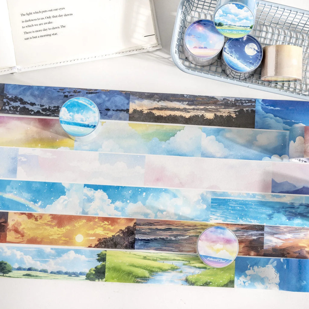Japanese paper washi tape roll with sky theme designs including clouds, sun, moon, and nebula patterns