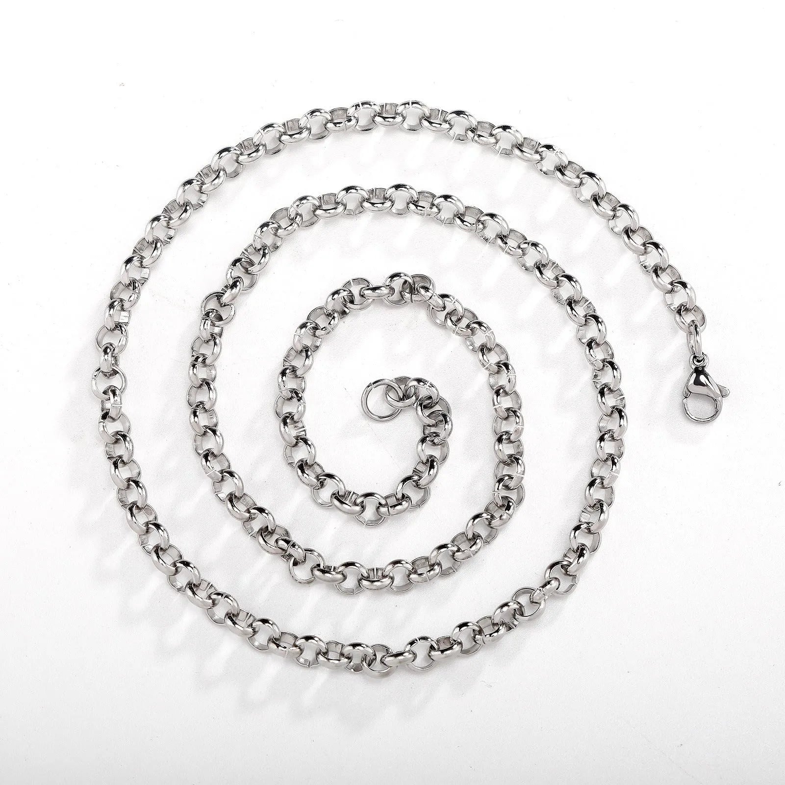 Silver stainless steel men's punk ring buckle necklace with O-ring chain on a neutral background