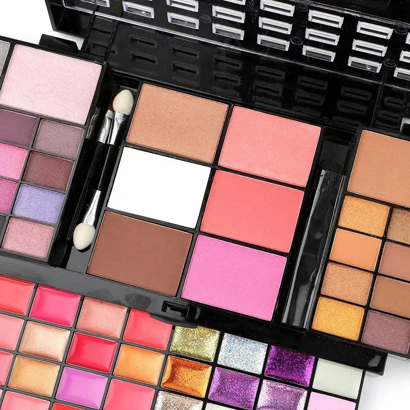 74 colour makeup palette with four layers, a mirror, and included brushes for eyeshadow, lip, and contour.