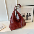 Soft PU leather large capacity shoulder bag in street style with sandwich pocket.