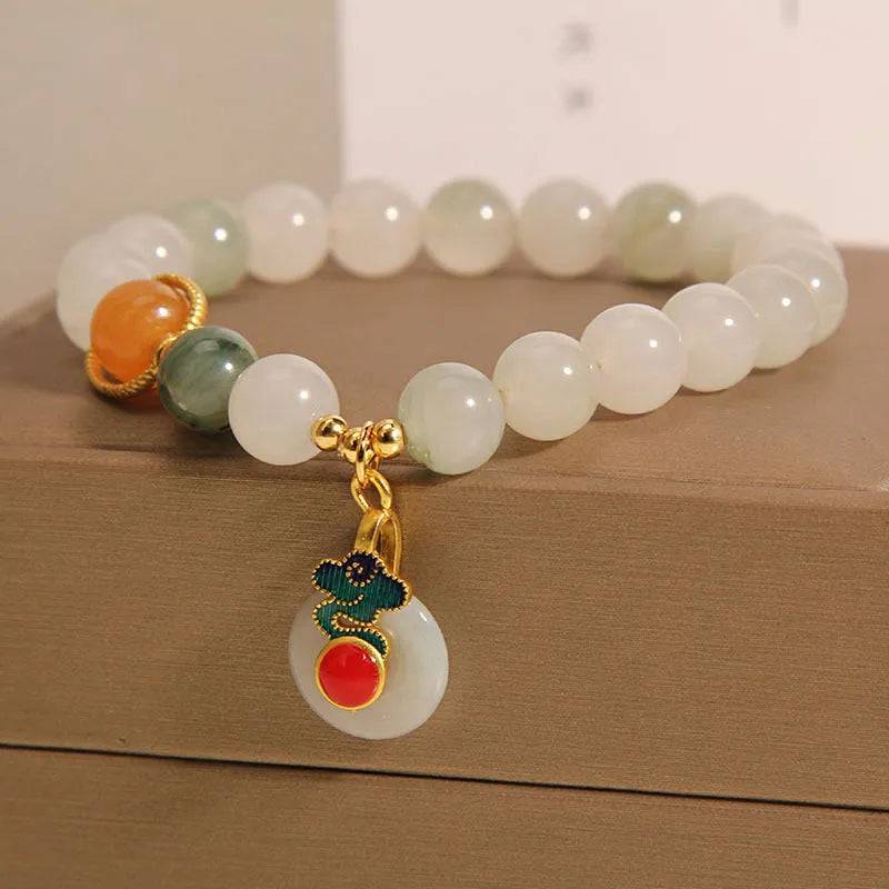Women's ice jade bracelet with pearl accents and traditional jade buckle