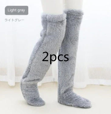 Cozy over-the-knee fuzzy socks in various colors, designed to keep your legs and knees warm during the winter season.