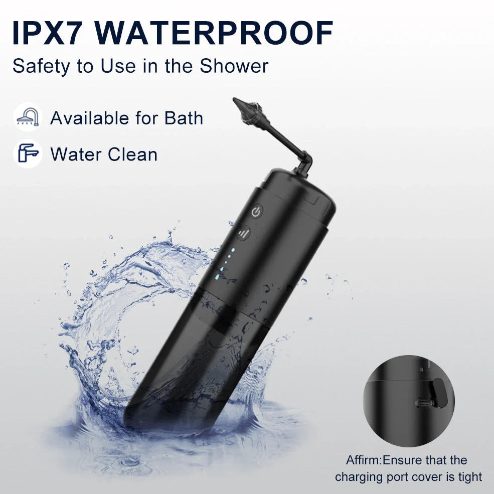 Black silicone ear washer with three nozzles and USB cable on white background