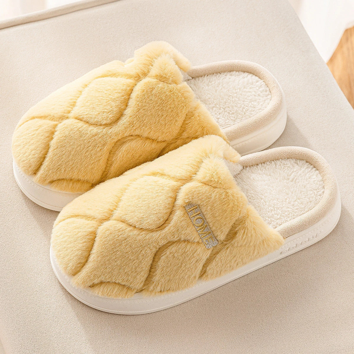 Cozy plush slippers with soft, plush upper material and durable PVC sole for comfortable and secure indoor wear