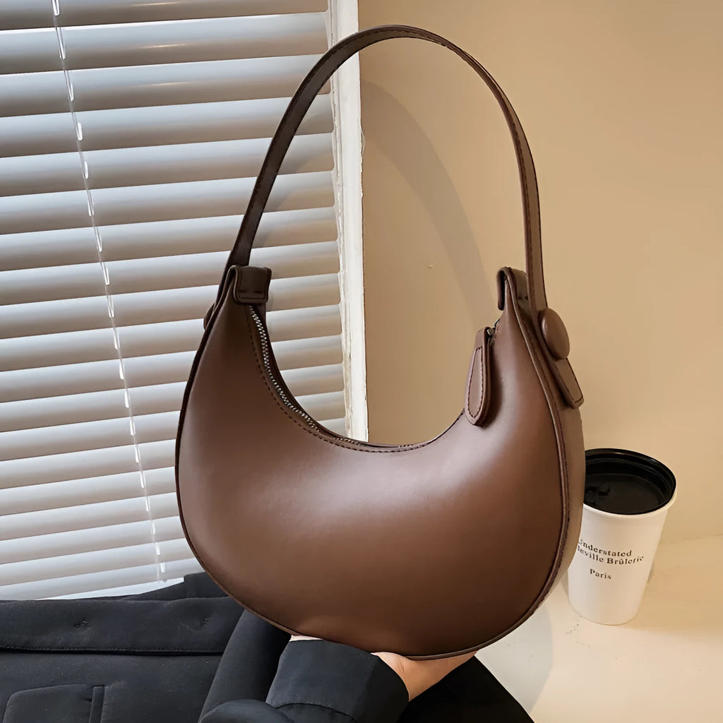 Retro dumpling-shaped women's shoulder bag in PU leather, shown in a choice of four colours.