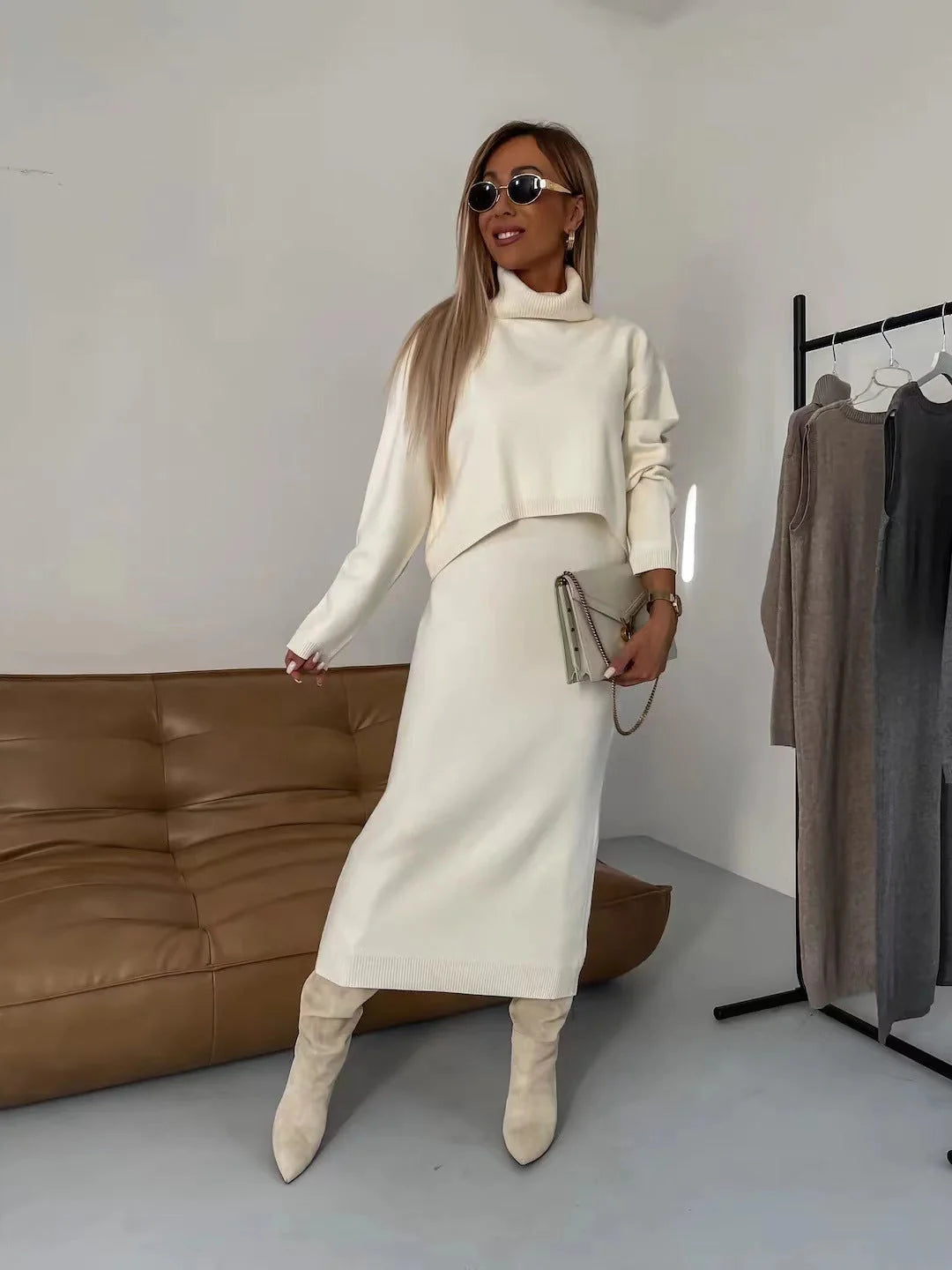 Women's winter fashion two-piece set featuring a turtleneck pullover and sleeveless long dress in white, grey, or camel.