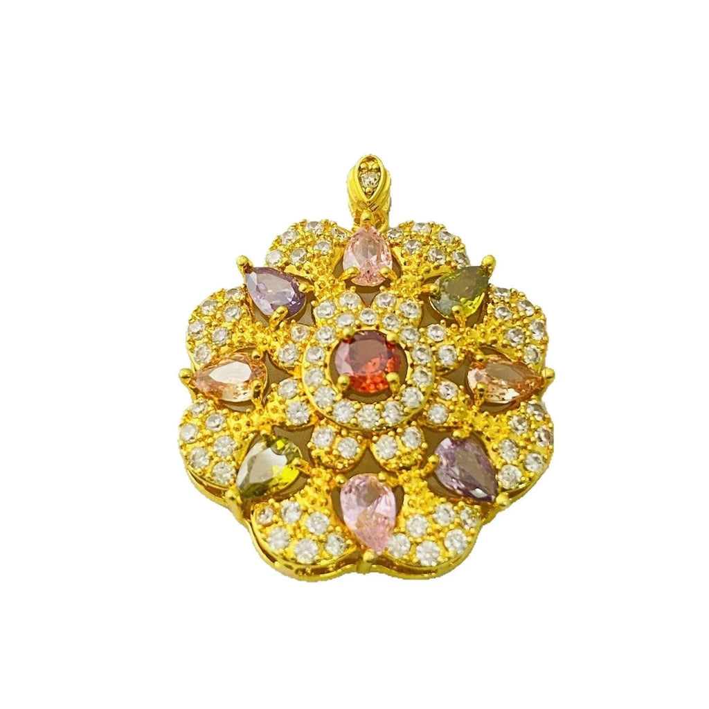 Close-up of a women's flower-shaped zircon pendant necklace in a gold tone on a model.
