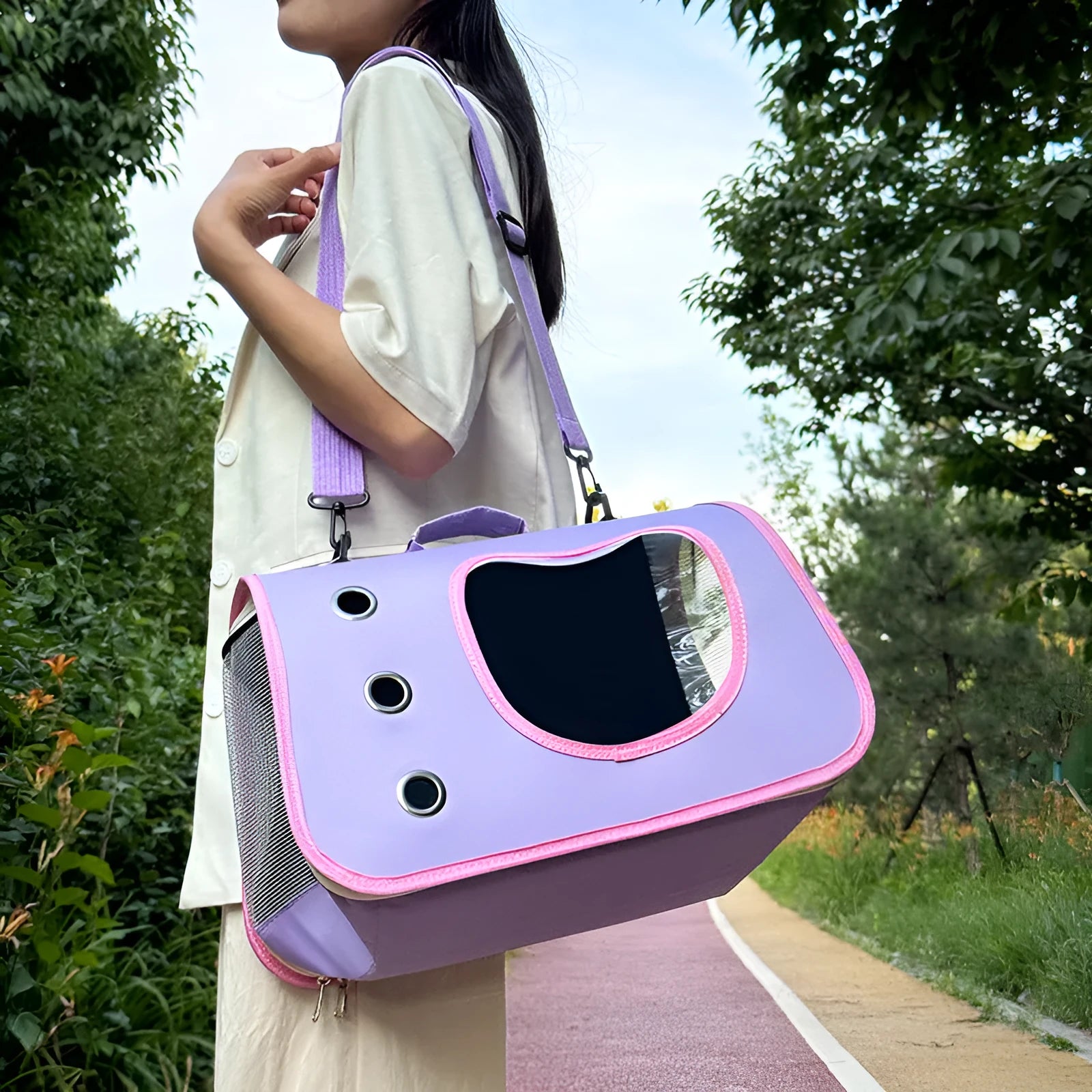 Crossbody pet carrier bag in Oxford cloth shown in multiple colour options including black, orange, and purple