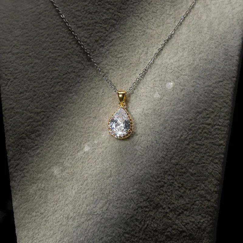 Drop-shaped zircon non-fading three-piece jewellery set gold plated with mixed gem inlaid pendant in emerald gold colour on white background
